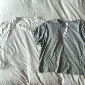 Two lululemon cates crop tees in size 2, gray and white